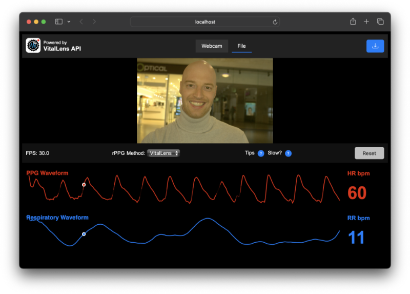 Screenshot of a health monitoring dashboard displaying a blurred face under "File" tab with real-time vital signs data. It features red PPG waveform and heart rate of 60 bpm, blue respiratory waveform and respiratory rate of 11 bpm, along with controls for PPG method and tips on slow breathing.